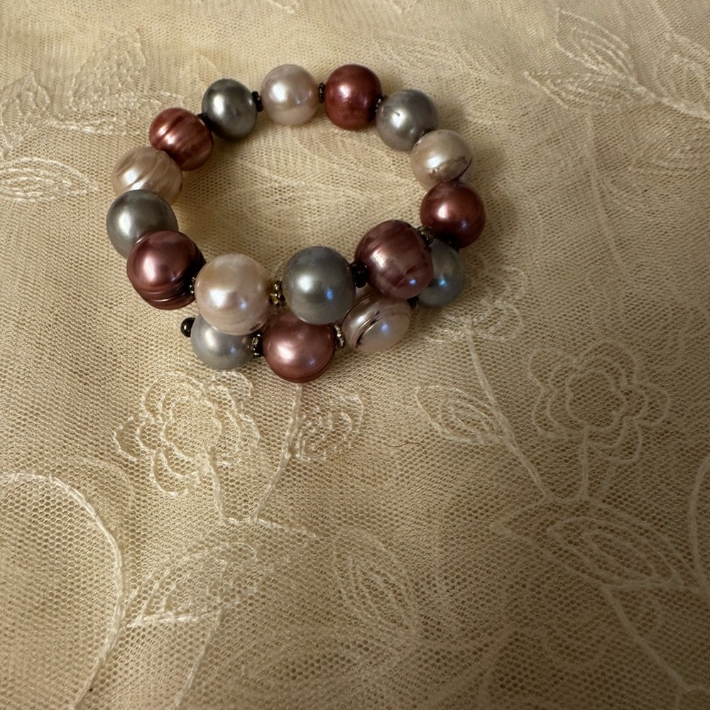 Genuine Coil Pearl Bracelet in Pink, Gray, and cream alternating.